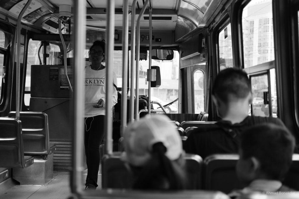 Passengers inside a Toronto transit vehicle, black and white