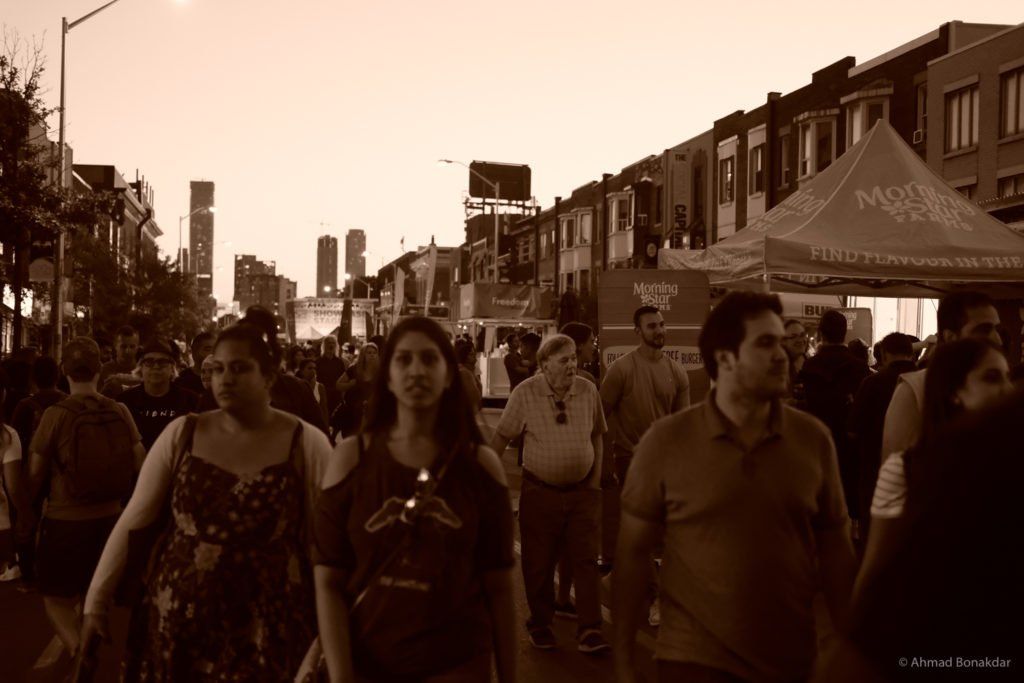 A crowded street festival on the Danforth