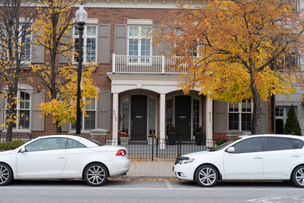 Autumn trees and townhouses on an Oakville street