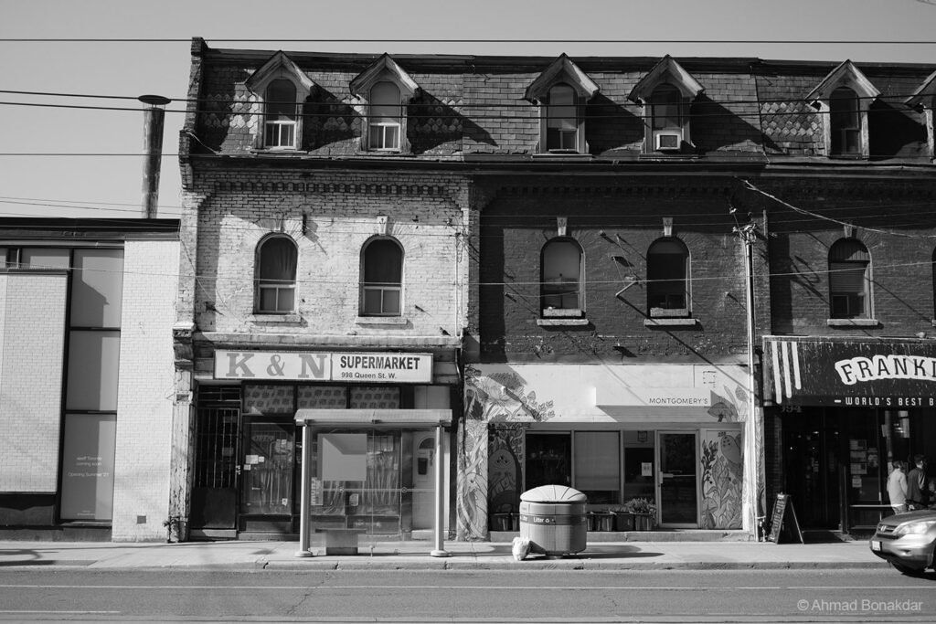 Victorian storefronts on a Toronto street, black and white